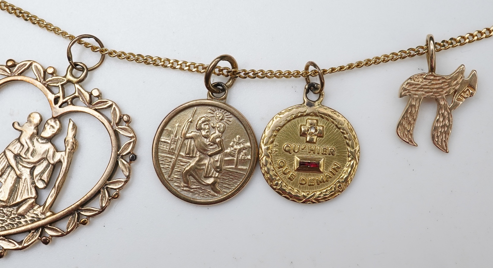 A gold necklace and pair of earrings